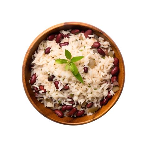 Premium Photo | A bowl of rice with beans and a leaf of basil