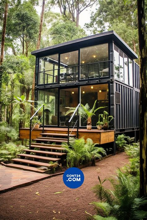 a house in the woods with stairs leading up to it