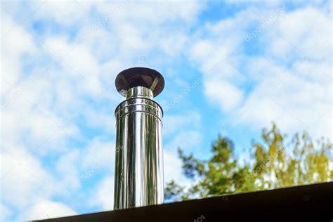 Modern chimney on the roof — Stock Photo © scaliger #64705213