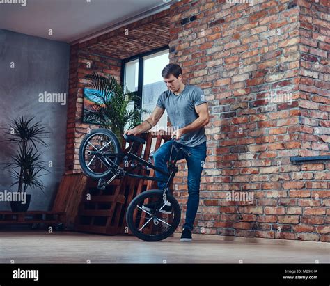 A handsome man with BMX in a studio Stock Photo - Alamy