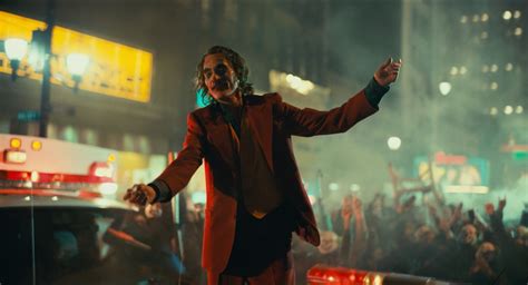 Joker standing on cop car during riot, in Joker 2019 (Batman) Blank ...