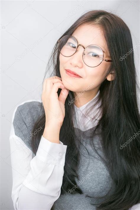 Beautiful asian women wear glasses — Stock Photo © benedixs #110481536