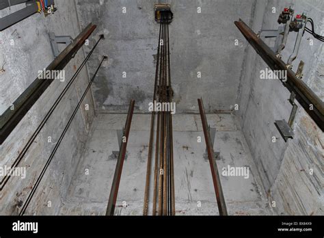 Cables and pulley inside an elevator shaft Stock Photo - Alamy