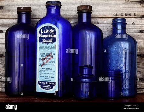 Cobalt blue glass bottles Stock Photo - Alamy