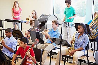 Pupils Playing Musical Instruments In School Orchestra - Stock Image ...