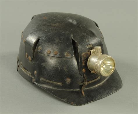 A vintage miners helmet, by Huwood "Light Type Hat".