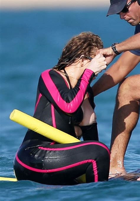 MARIAH CAREY in Wetsuit at a Beach in Italy 06/22/2015 – HawtCelebs