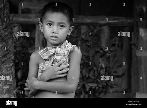 Young Lao boy in the village of Nong Khiaw Stock Photo - Alamy