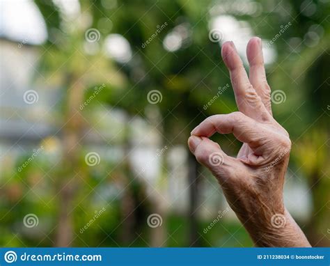 Hand of a Senior Woman Showing OK Symbol with Copy Space for Text Stock Photo - Image of hand ...