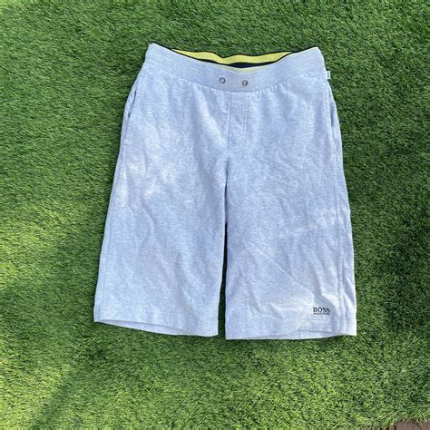 Grey Hugo boss shorts. Size S but will fit a M due... - Depop