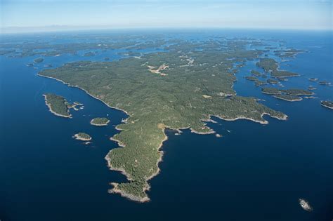 The archipelago scene varies from larger islands dotted with rustic ...