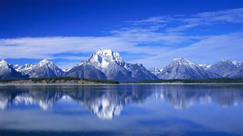 Landscape View Of Mountain Under Blue Cloudy Sky With Reflection On ...