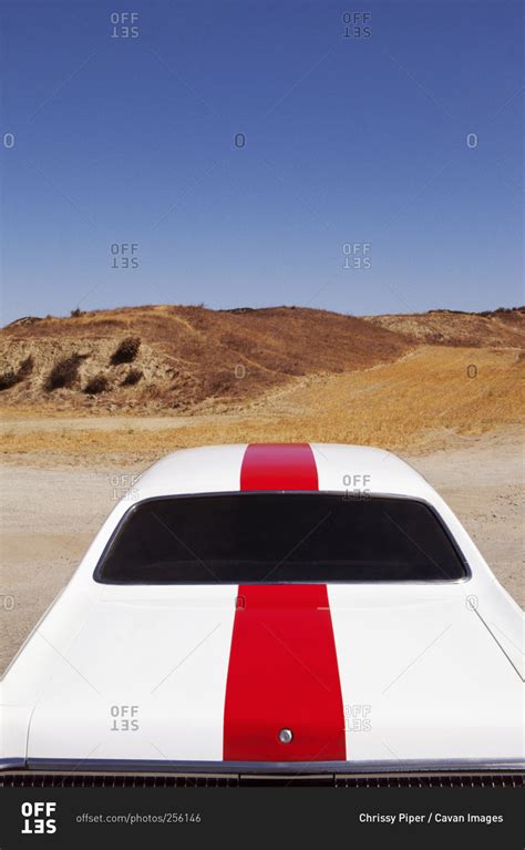 Classic racing car in desert setting stock photo - OFFSET