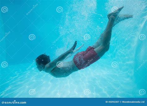 Young Man Swimming Underwater Stock Image - Image of young, underwater ...