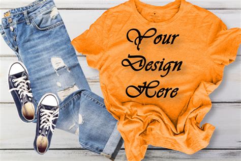 Orange T-shirt Mockup Graphic by Art Studio · Creative Fabrica