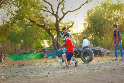 Rural Indian Child Playing Cricket Stock Photo | Adobe Stock