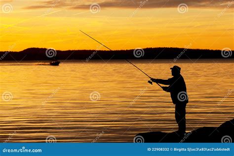 A fisherman in sunset. stock photo. Image of enjoyment - 22908332