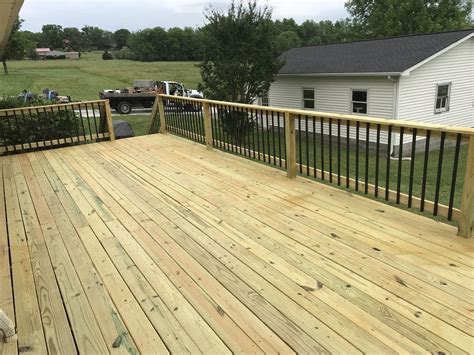 Deck Spindles Wood Deck With Black Metal Spindle Rail - vrogue.co