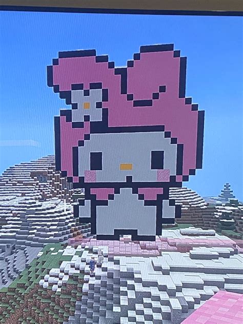 an image of a hello kitty pixel art on a tv screen in the living room