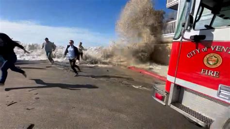 Video shows people scrambling as massive wave engulfs California ...