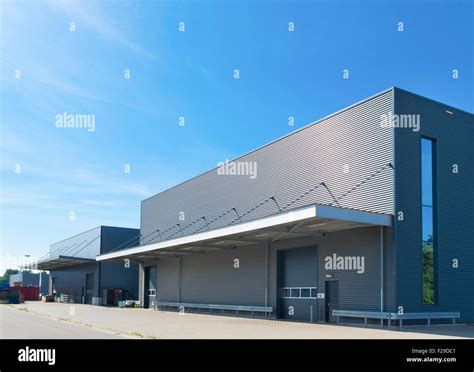 exterior of a modern warehouse building against a blue sky Stock Photo ...