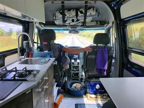 the interior of an rv with two sinks and a kitchen area in front of it