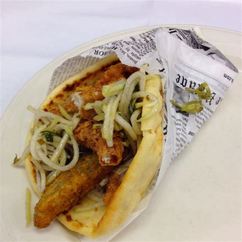 Buttermilk Fried Catfish Sandwich on Flatbread with Fried Pickle Wedge and Chayote Slaw ...