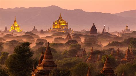 Pagoda landscape under a warm sunset in the plain of Bagan, Myanmar ...