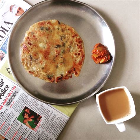 Delicious crispy aloo paratha a with lots and lots of ghee. Because we punjabis can never have ...