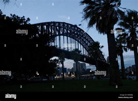 Sydney, Australia - Sydney Harbour Bridge and sidewalk at night Stock ...