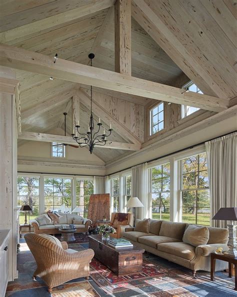 Great room at waterfront estate with beams and paneled cathedral ceiling by Barnes Vanze ...