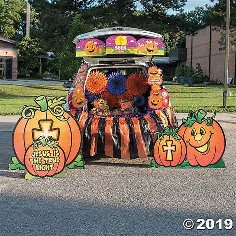 a car decorated with pumpkins and decorations