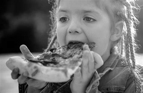 Premium Photo | Kids favorite food Tasty pizza Child eating pizza ...