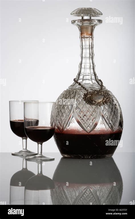 Decanter of Port and Port glasses with reflection Stock Photo - Alamy