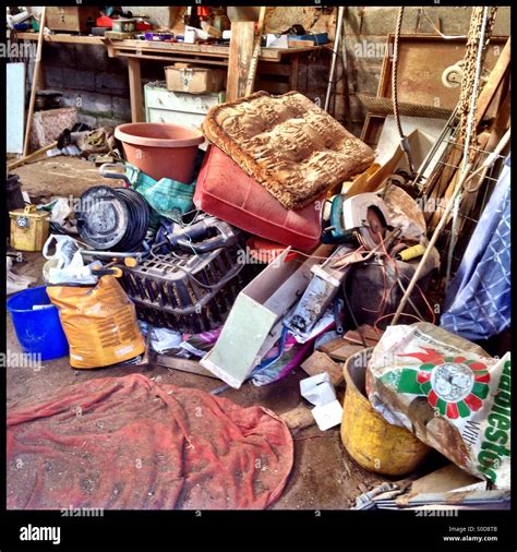 Pile of junk in large shed Stock Photo - Alamy