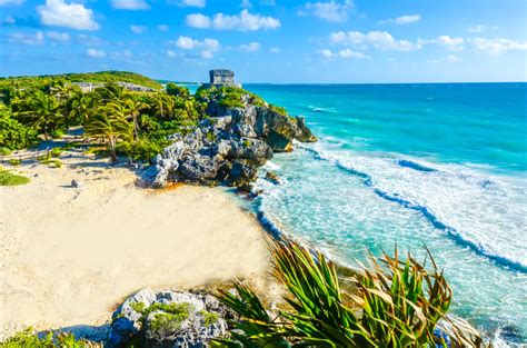 Mayan ruins of Tulum at tropical coast. God of Winds Temple at paradise ...