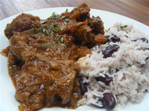 Chicken in a Cherry Sauce: Goat curry with rice and peas