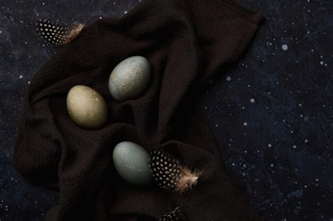 Premium Photo | Dyed eggs on black background easter celebration concept