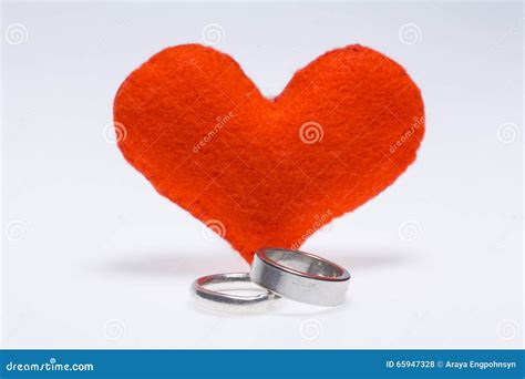 Couple Rings and a Heart stock photo. Image of gold, object - 65947328