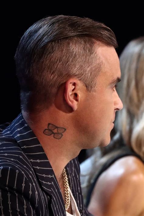 A tour of Robbie Williams' tattoos and their meanings | HELLO!