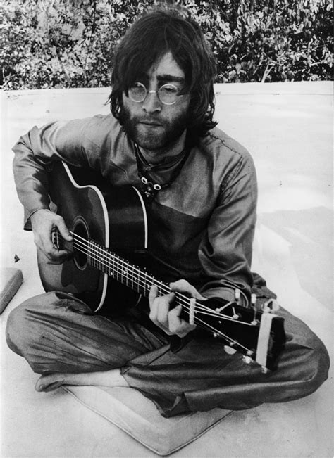 John Lennon Playing Guitar Young