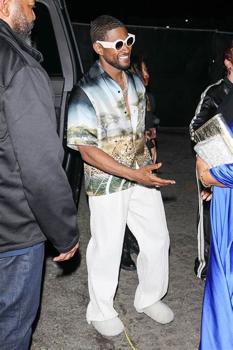 Usher is in good spirits exiting the Interscope roller skating event in ...