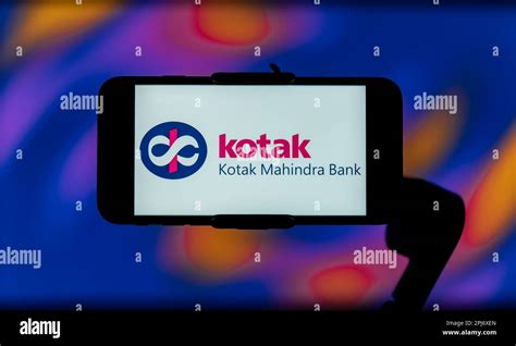 In this photo illustration, the Kotak Mahindra Bank logo is seen displayed on a mobile phone ...