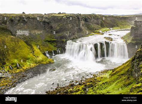 waterfall in green iceland landscape Stock Photo - Alamy