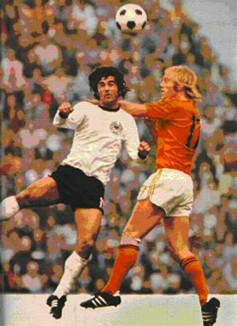 West Germany 2 Holland 1 in 1974 in Munich. Gerd Muller and Wim Rijsbergen in aerial battle in ...