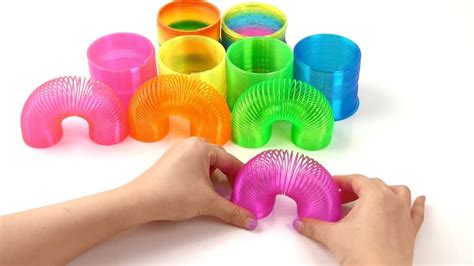 SMALLEST SLINKY how to play slinky KIDS SPRING TOYS - YouTube