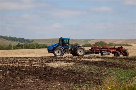 Tractor plowing the field — Stock Photo © Hackman #5535812