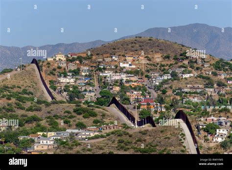 High view over Nogales Sonora Mexico from Nogales Arizona, looking southeast, showing US border ...