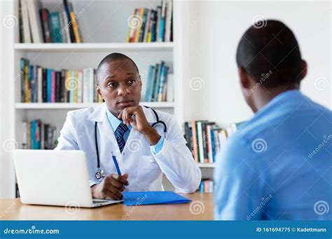 African American Doctor with Male Patient Stock Image - Image of attack ...