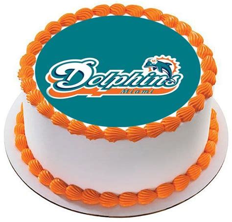 an orange and white cake with the miami dolphins logo on it